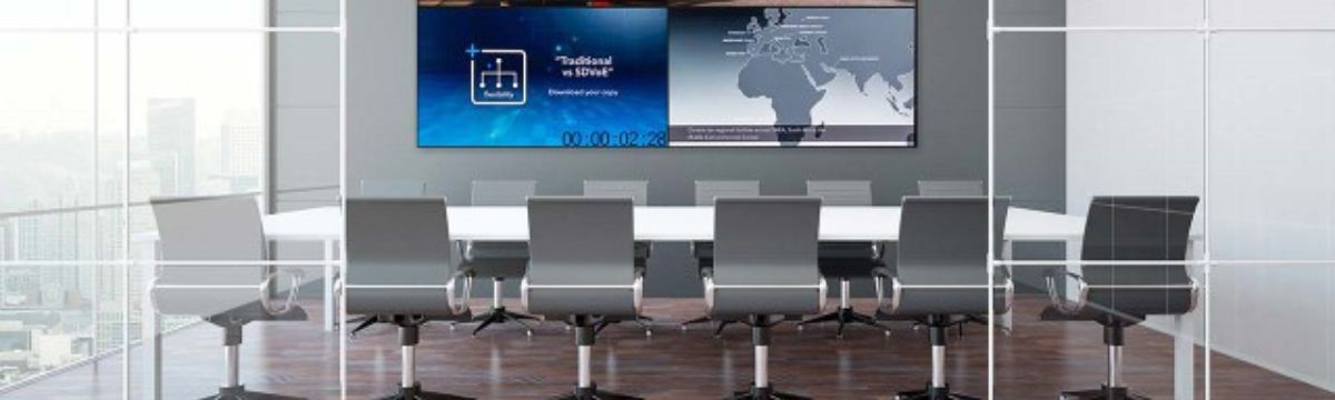 conference room with screens on the wall