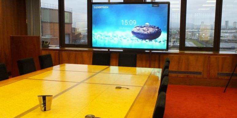 Empty boardroom with a screen