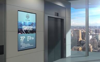 Digital signage in the office building beside an elevator